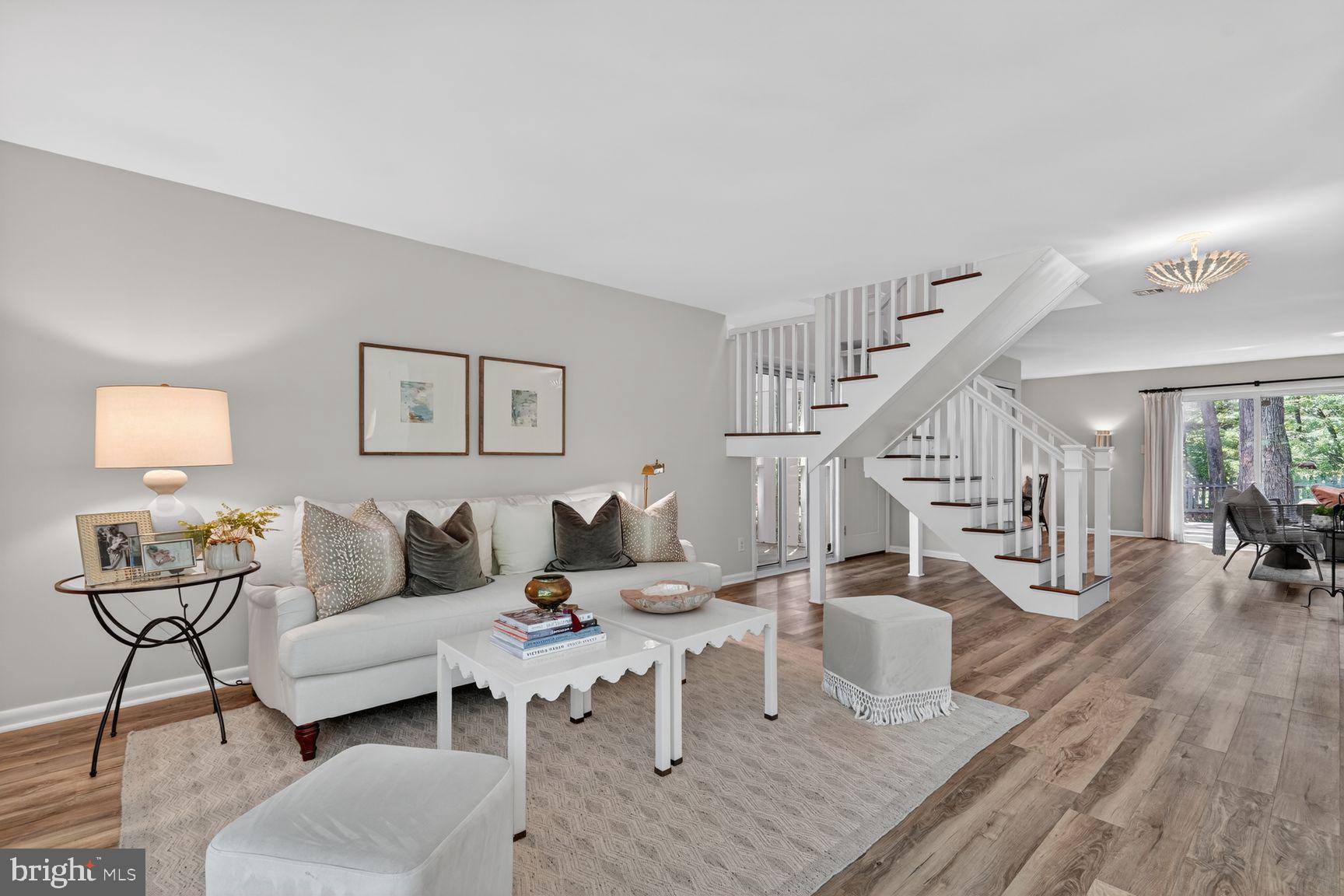 11201 Wedge Drive Reston, VA 20190 - Photo 1 of 31 a living room with furniture and wooden floor