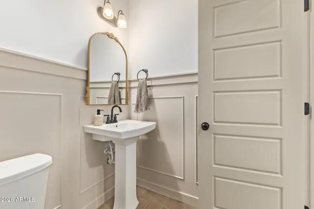 a kitchen with a sink a stove and cabinets