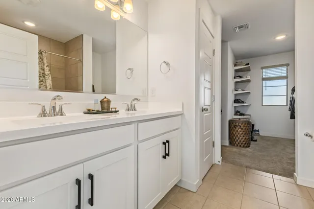 a bedroom with a bed a sliding door and a window