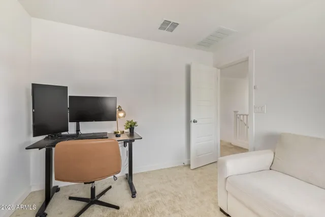 a workspace with furniture and a couch