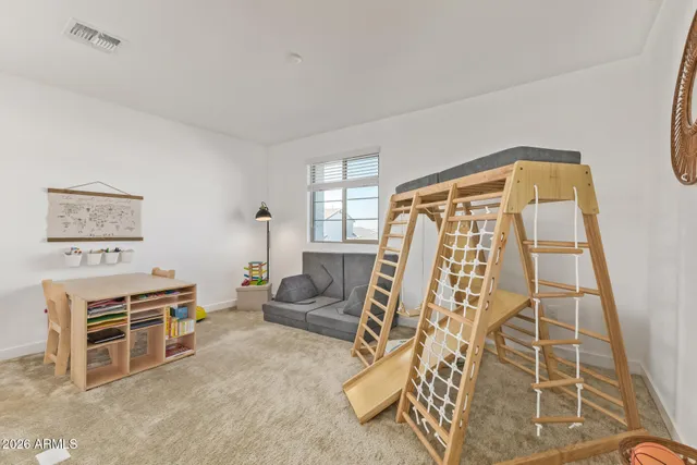 a living room with furniture a ceiling fan and a window