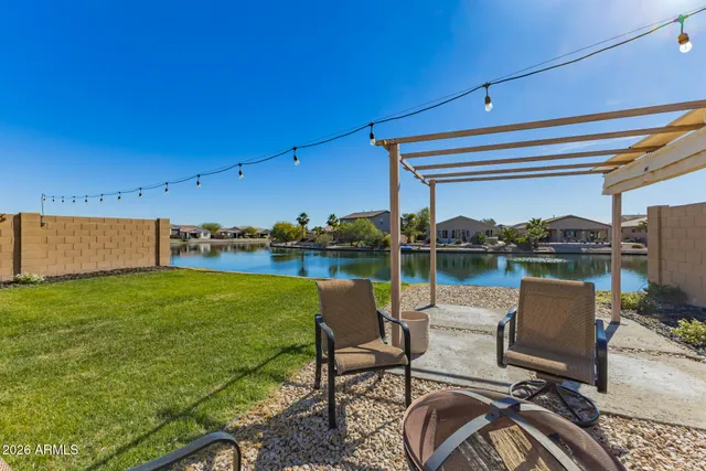 a view of a chairs and table in patio