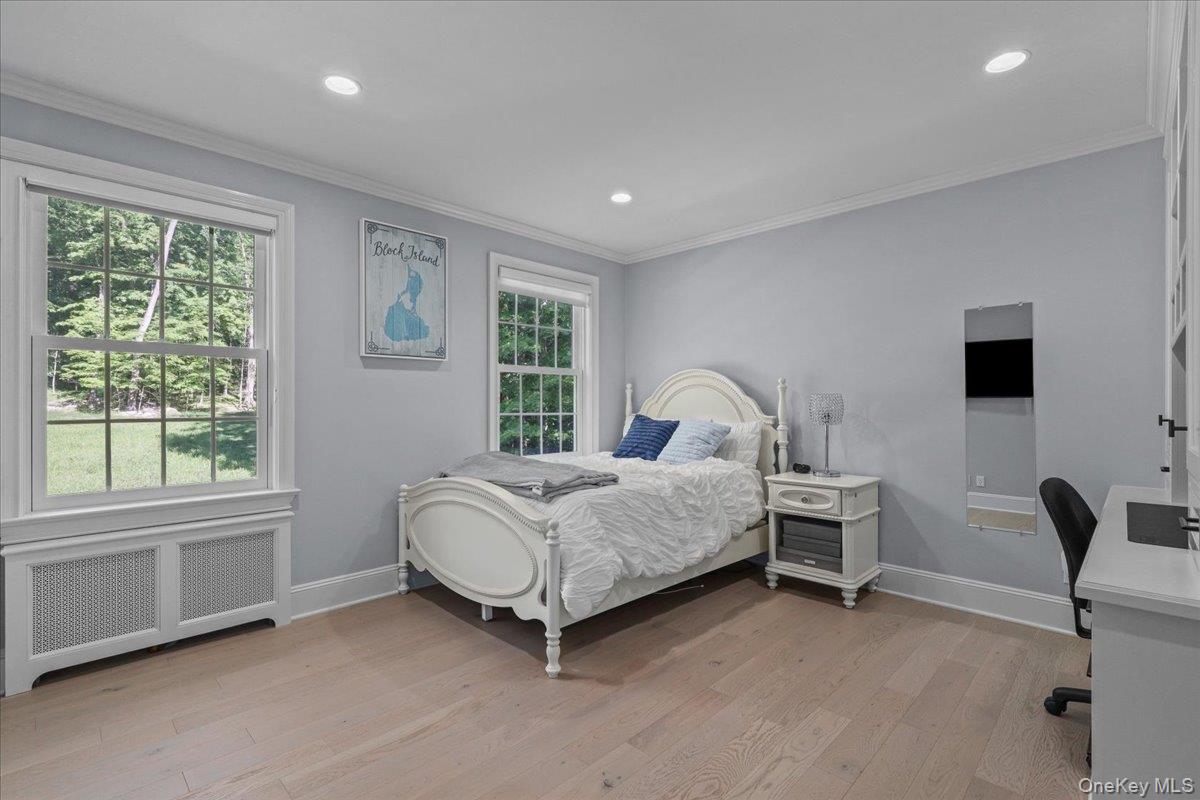 135 Pines Bridge Road Katonah, NY 10536 - Photo 27 of 40 a spacious bedroom with a bed chair and window