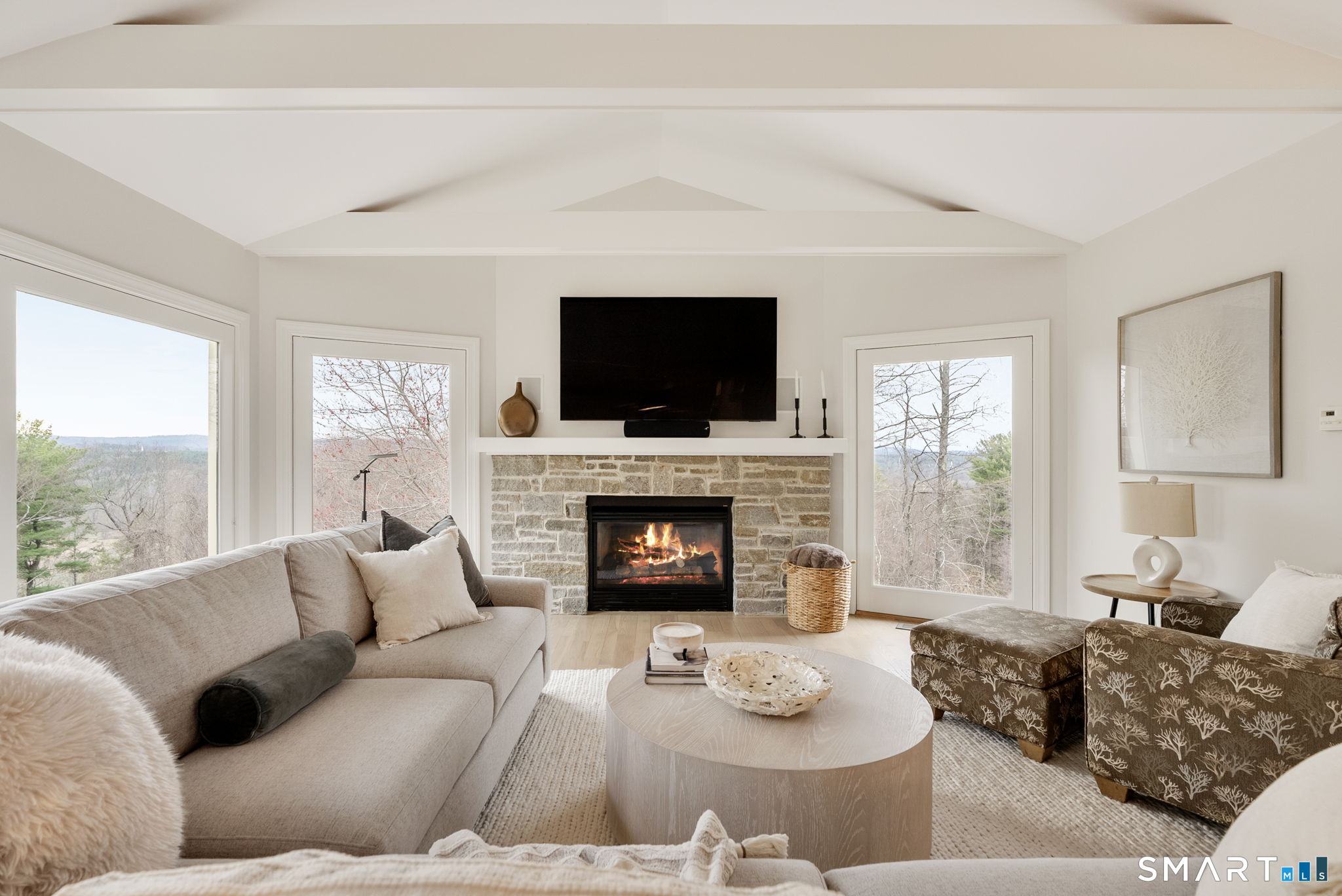 15 Cobtail Way Simsbury, CT 06070 - Photo 12 of 40 a living room with furniture a fireplace and a flat screen tv