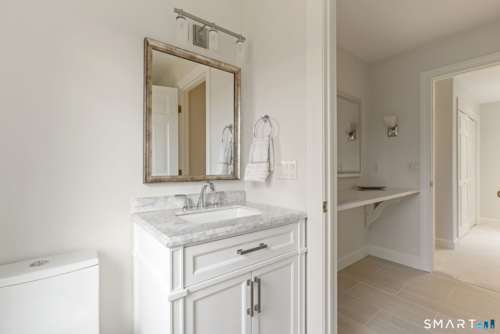 15 Cobtail Way Simsbury, CT 06070 - Photo 27 of 40 a bathroom with a granite countertop sink and a mirror