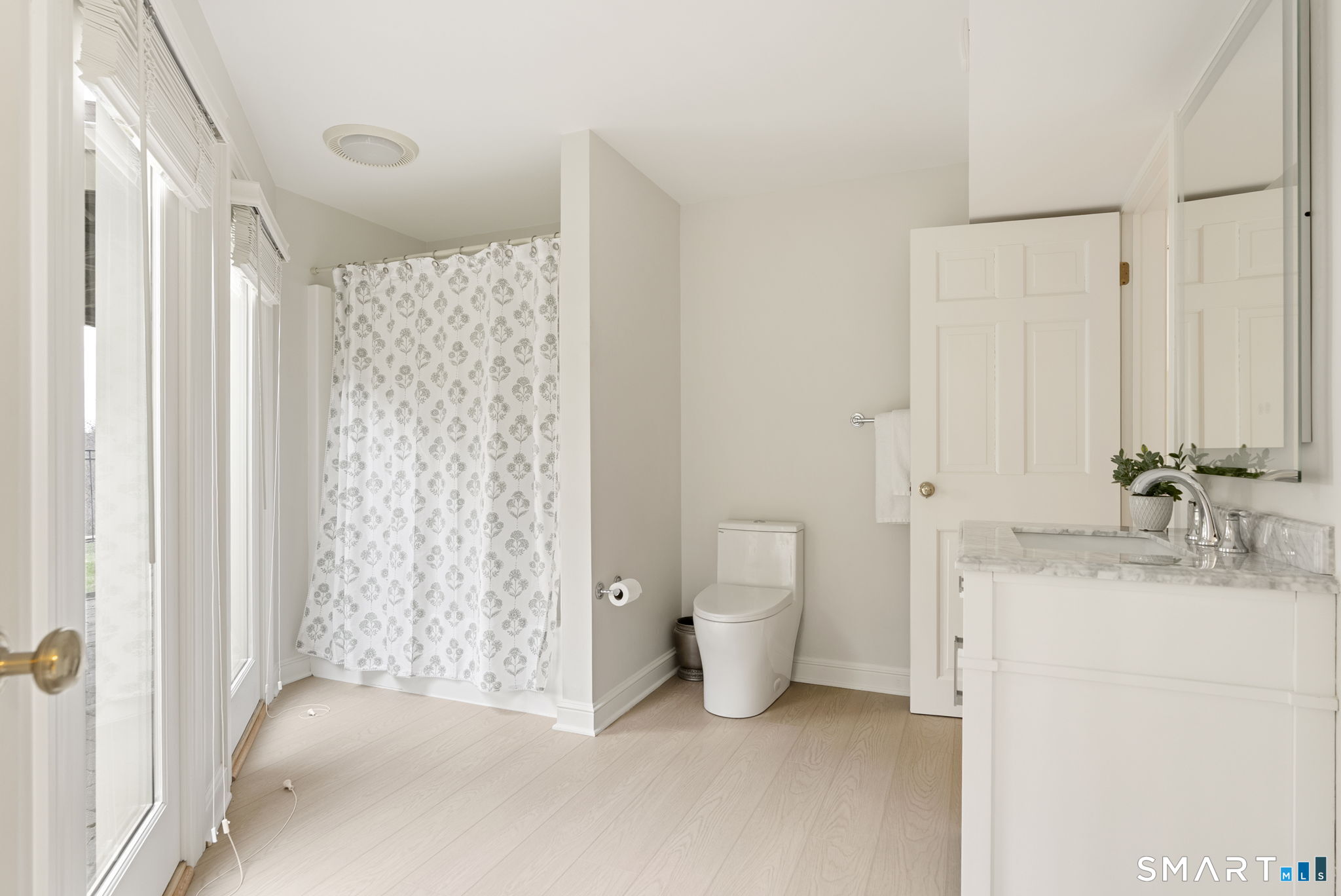 15 Cobtail Way Simsbury, CT 06070 - Photo 31 of 40 a bathroom with a granite countertop sink a toilet and shower