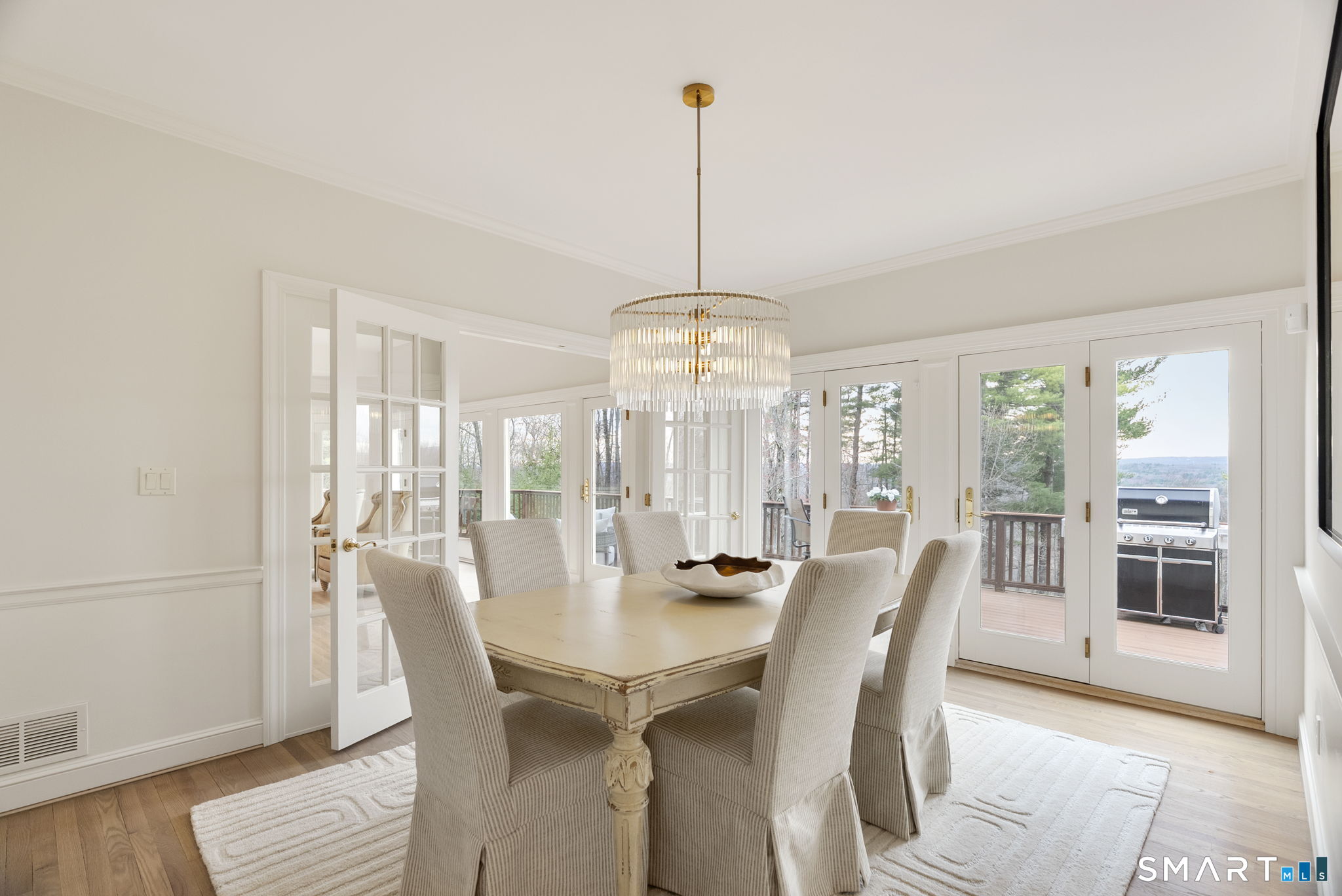 15 Cobtail Way Simsbury, CT 06070 - Photo 6 of 40 a view of a dining room with furniture wooden floor and chandelier