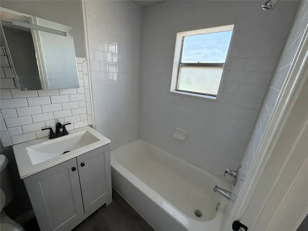 a bathroom with a sink and a bathtub