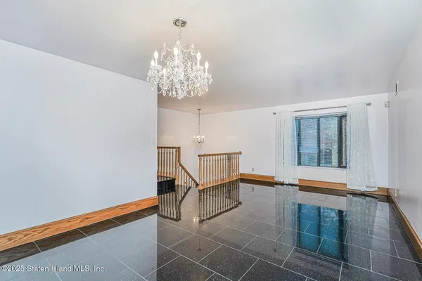 a view of a chandelier and entryway