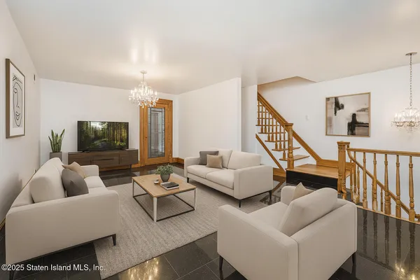 a living room with furniture and a flat screen tv