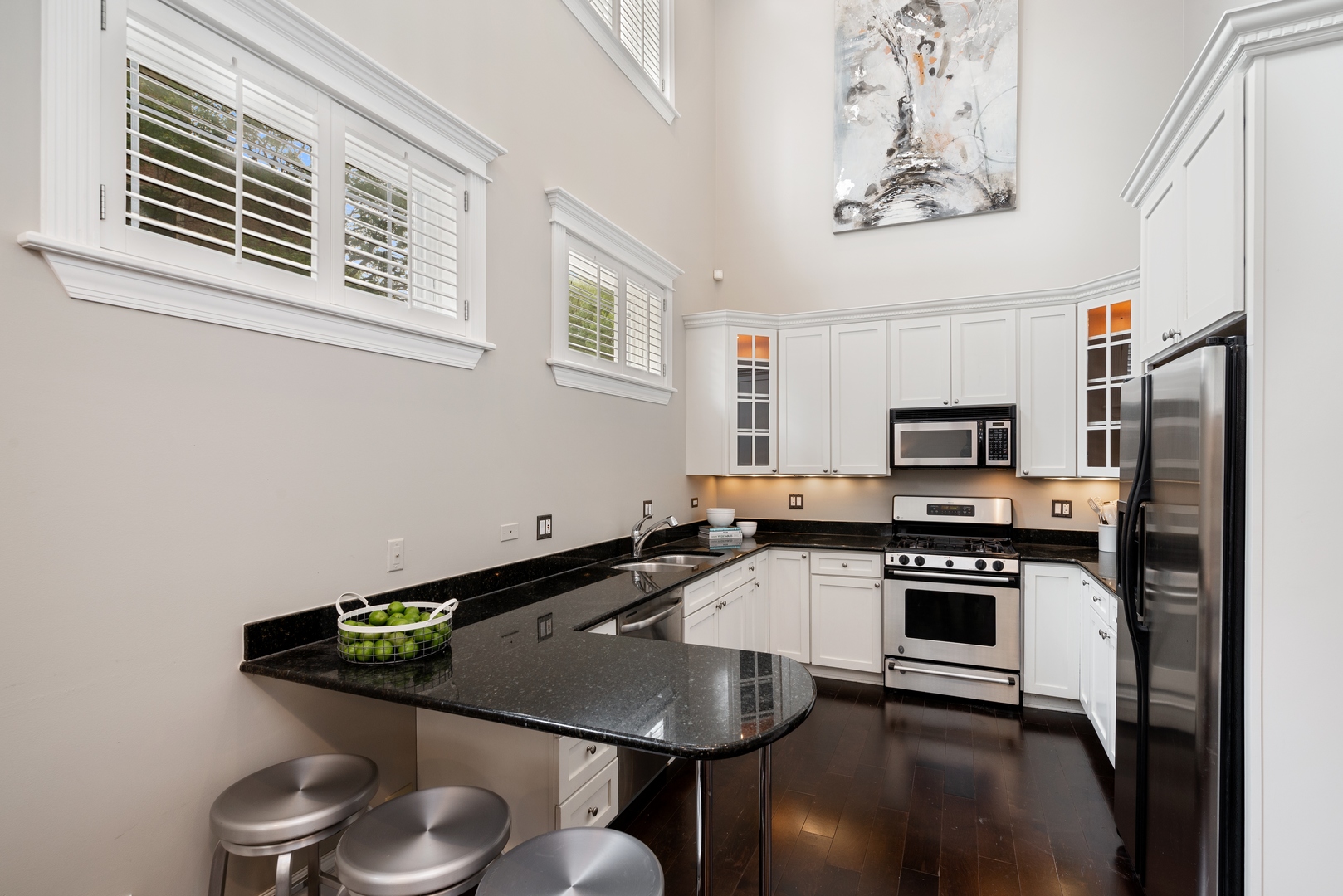 1503 North Mohawk Street, Unit 1E Chicago, IL 60610 - Photo 11 of 25 a kitchen with stainless steel appliances a stove a sink and a microwave