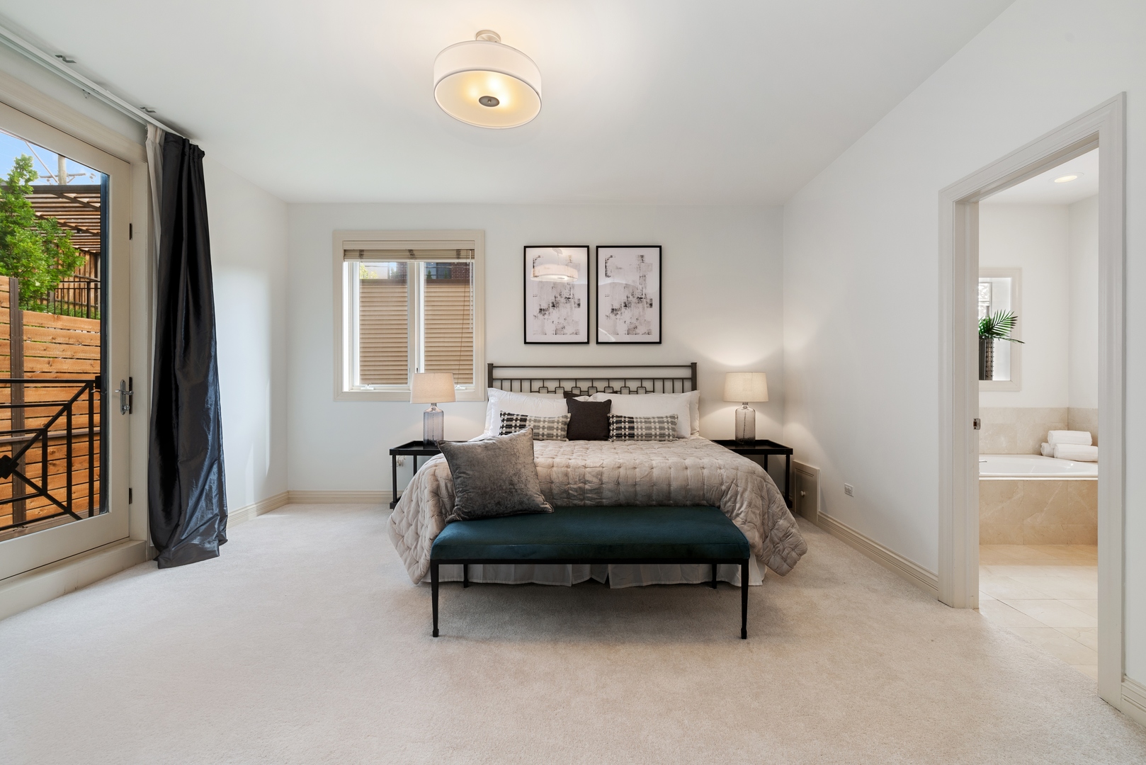 1503 North Mohawk Street, Unit 1E Chicago, IL 60610 - Photo 14 of 25 a spacious bedroom with a bed and a chandelier