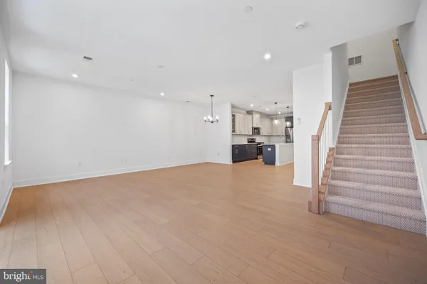 a view of kitchen and wooden floor