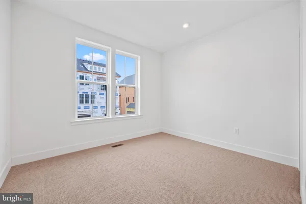 a bedroom with a bed and a chair