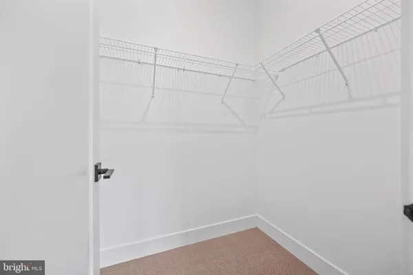 a view of an empty room with windows