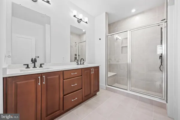 a bathroom with a glass shower door