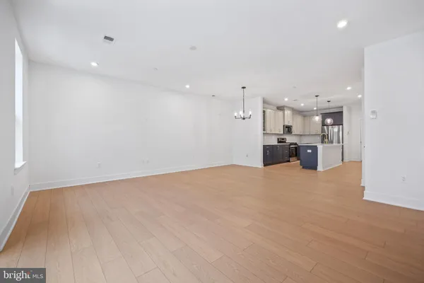 a view of kitchen and refrigerator