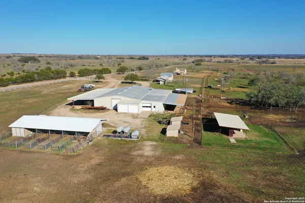 an aerial view of a house with a garden