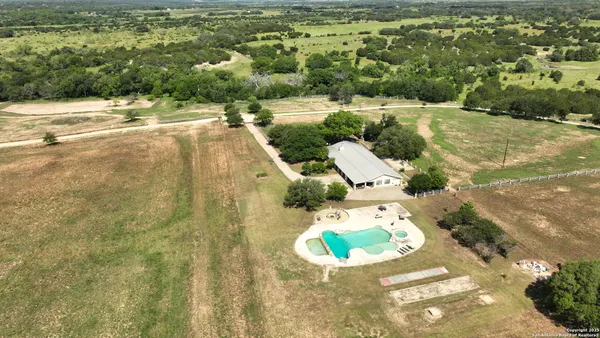a view of a swimming pool with a yard