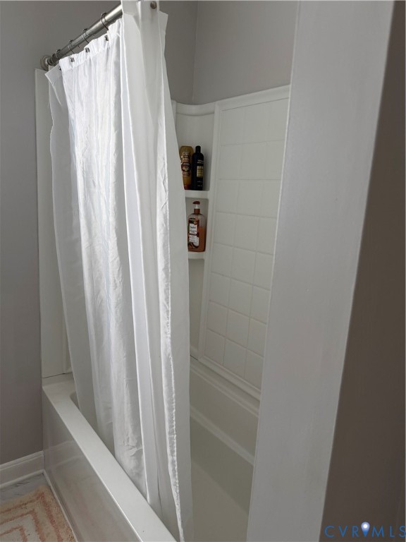 5247 Rockland Road Richmond, VA 23225 - Photo 5 of 9 Tub and shower combination featuring white tiled s
