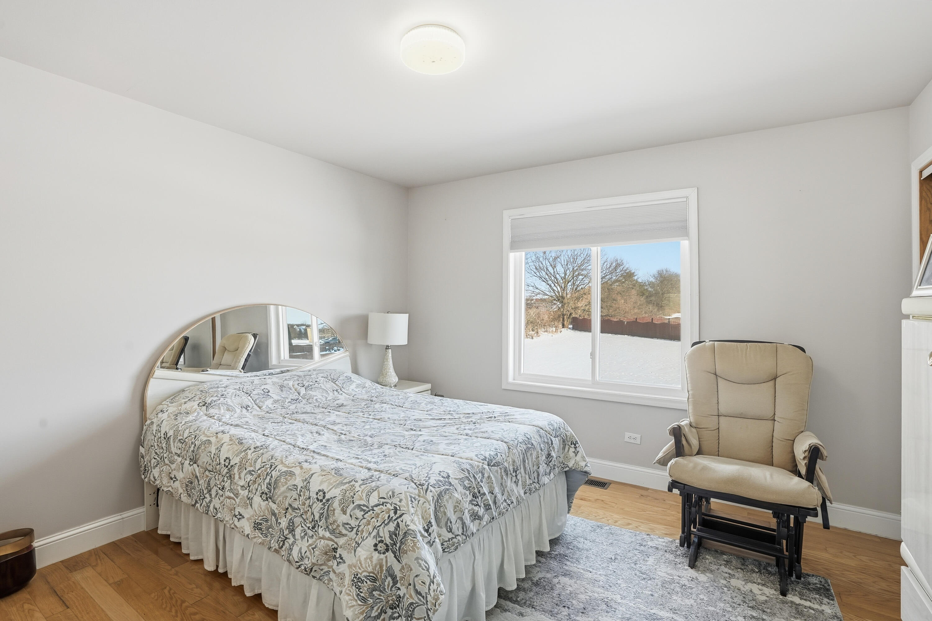 11109 Iowa Street Crown Point, IN 46307 - Photo 16 of 31 a bedroom with a bed and a couch