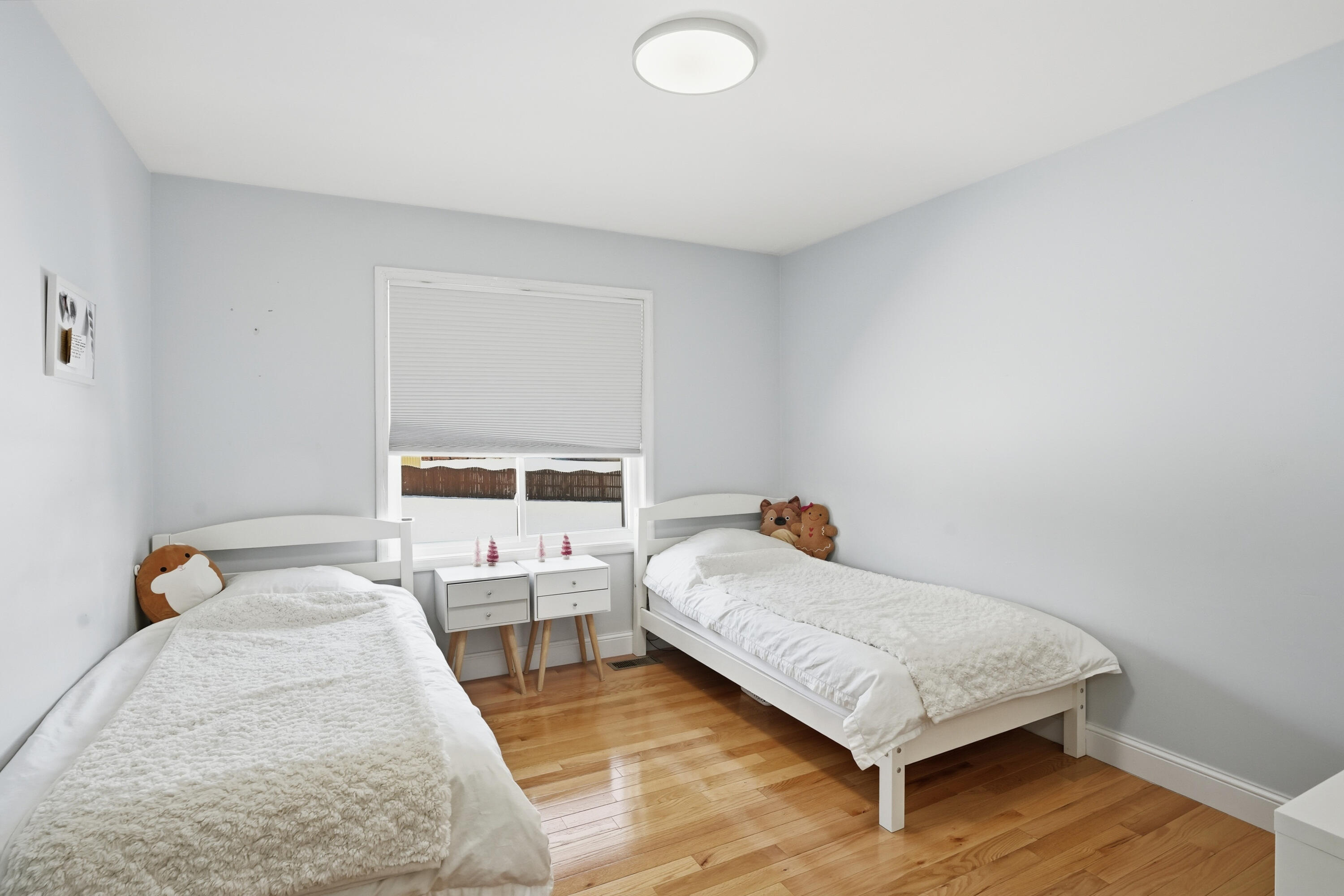 11109 Iowa Street Crown Point, IN 46307 - Photo 18 of 31 a bedroom with a bed and window
