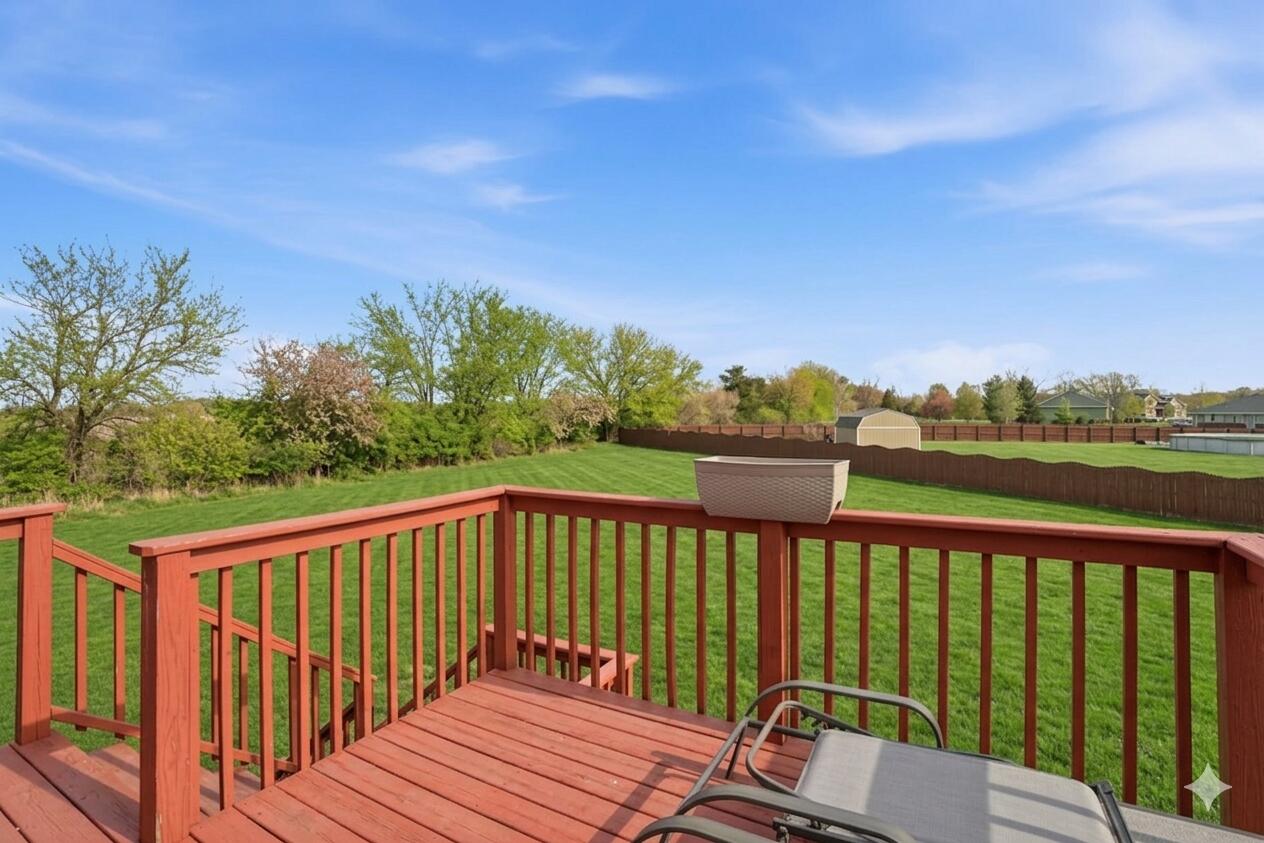 11109 Iowa Street Crown Point, IN 46307 - Photo 2 of 28 a view of a two chairs on the roof deck