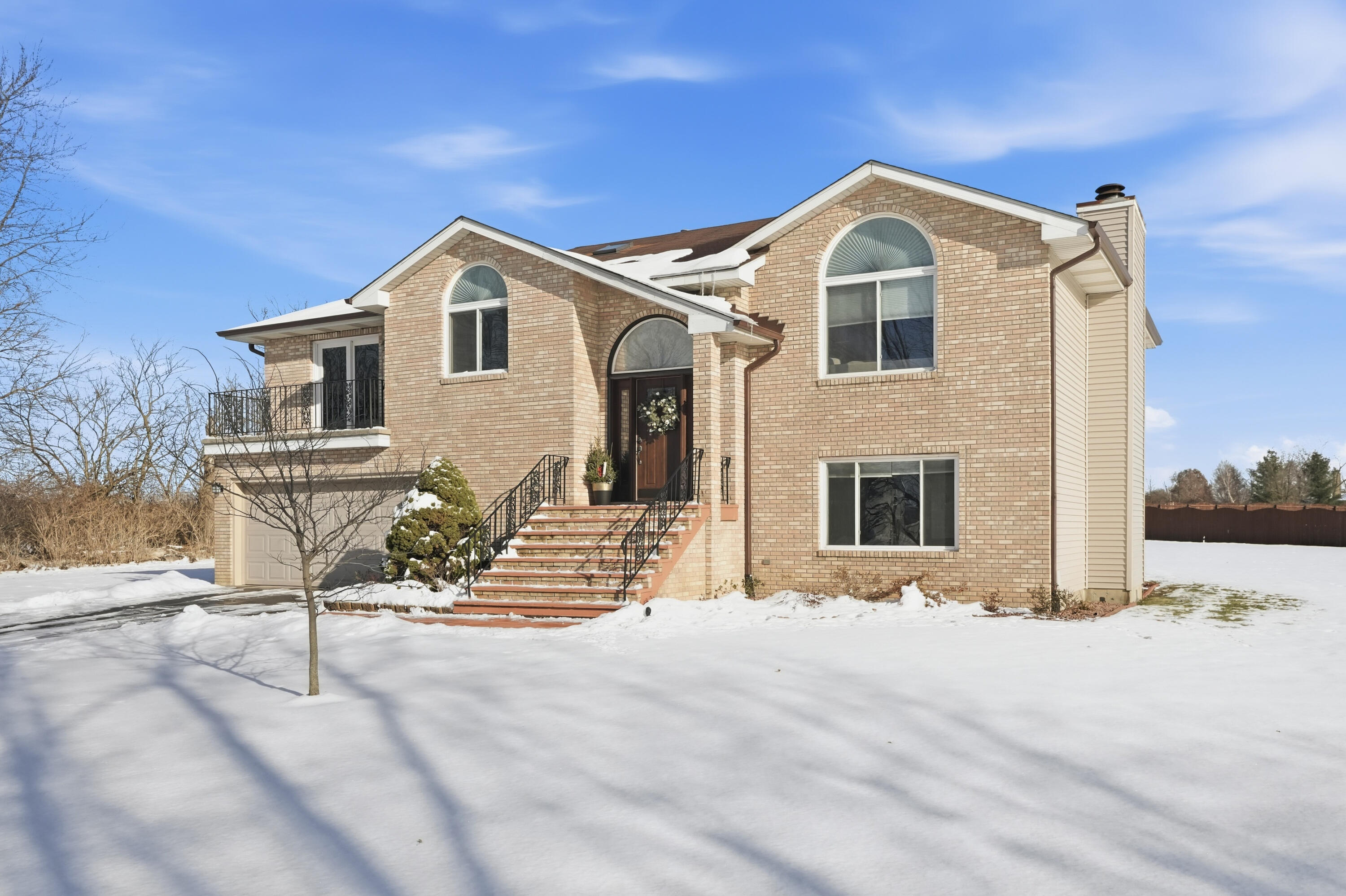 11109 Iowa Street Crown Point, IN 46307 - Photo 2 of 31 a front view of a house with a yard