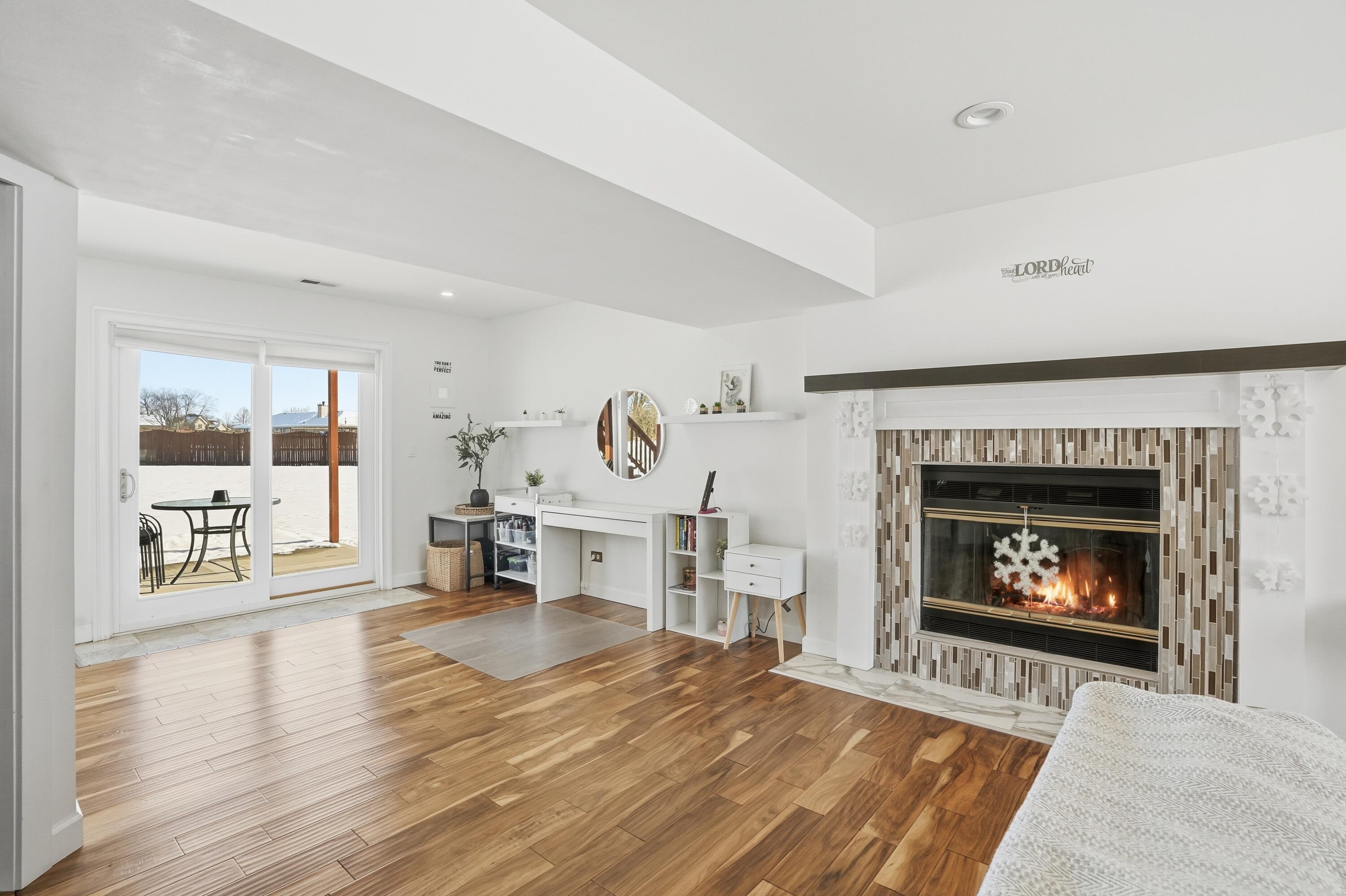 11109 Iowa Street Crown Point, IN 46307 - Photo 21 of 31 a living room with furniture and a fireplace
