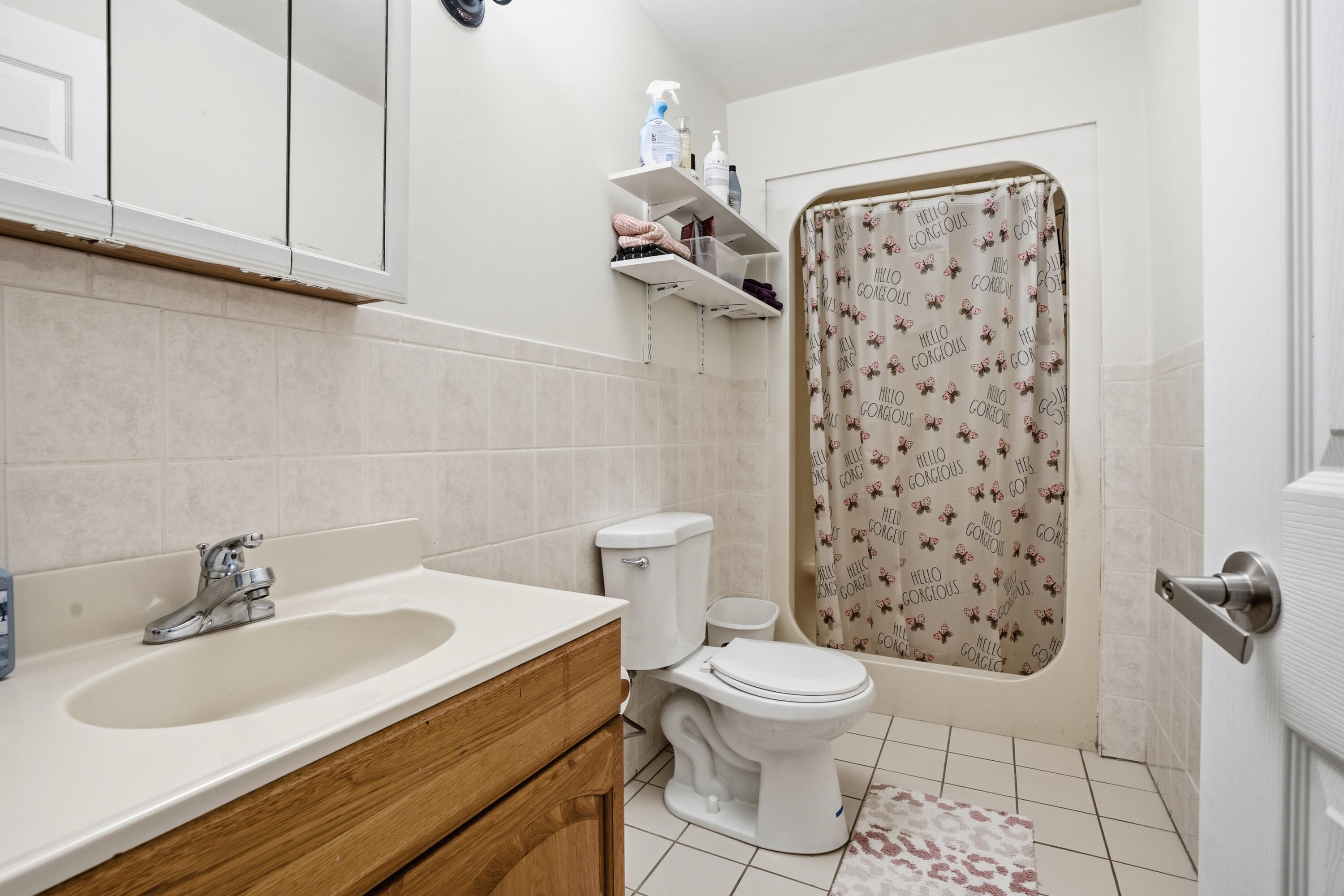 11109 Iowa Street Crown Point, IN 46307 - Photo 24 of 28 a bathroom with a sink toilet and shower