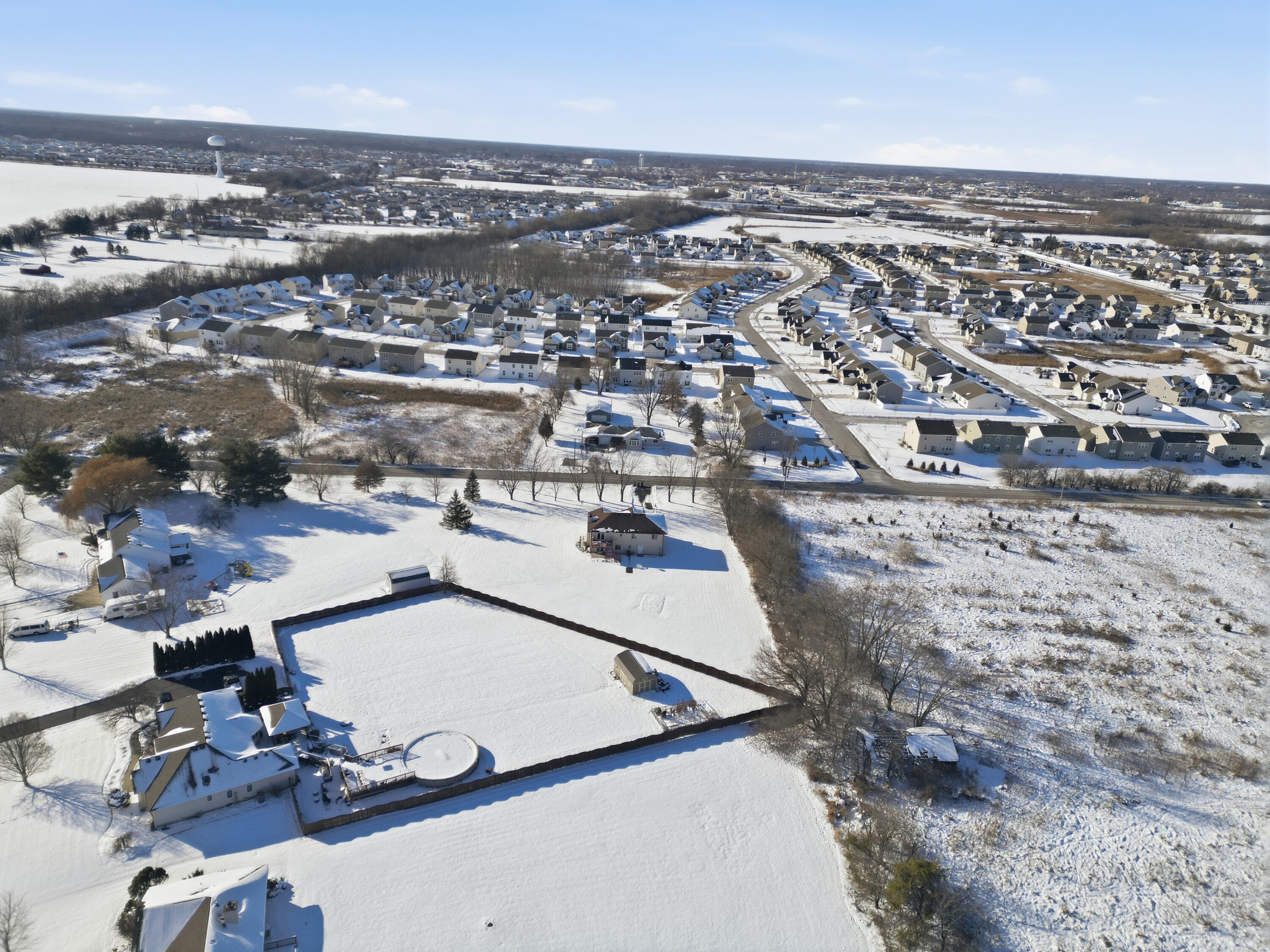11109 Iowa Street Crown Point, IN 46307 - Photo 26 of 31 an aerial view of residential houses with outdoor space