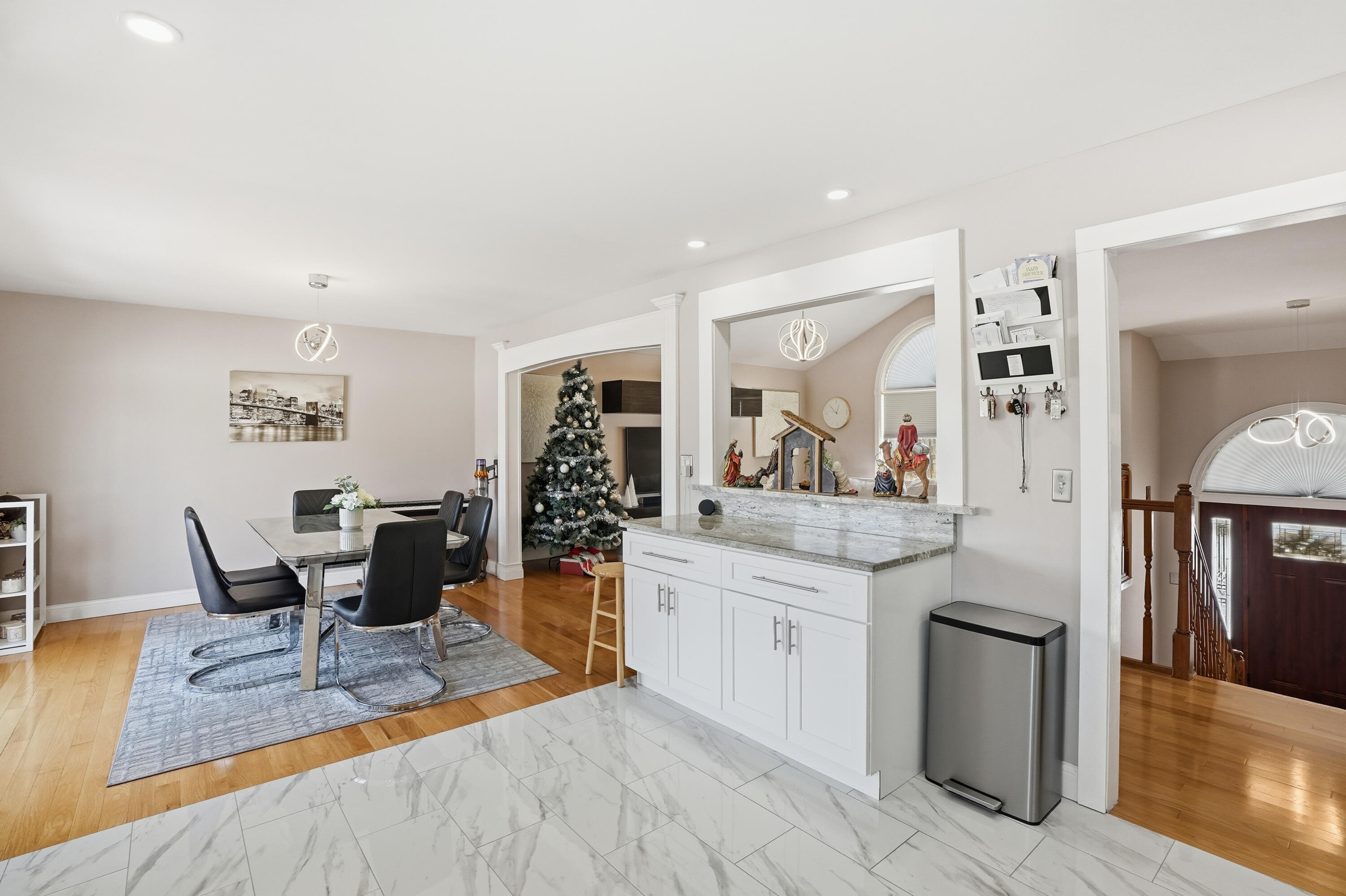 11109 Iowa Street Crown Point, IN 46307 - Photo 7 of 31 a view of a dining room with furniture and wooden floor