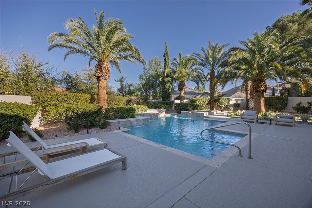 8800 Lusso Las Vegas, NV 89134 - Photo 77 of 85 View of swimming pool with patio surround and an in-ground hot tub