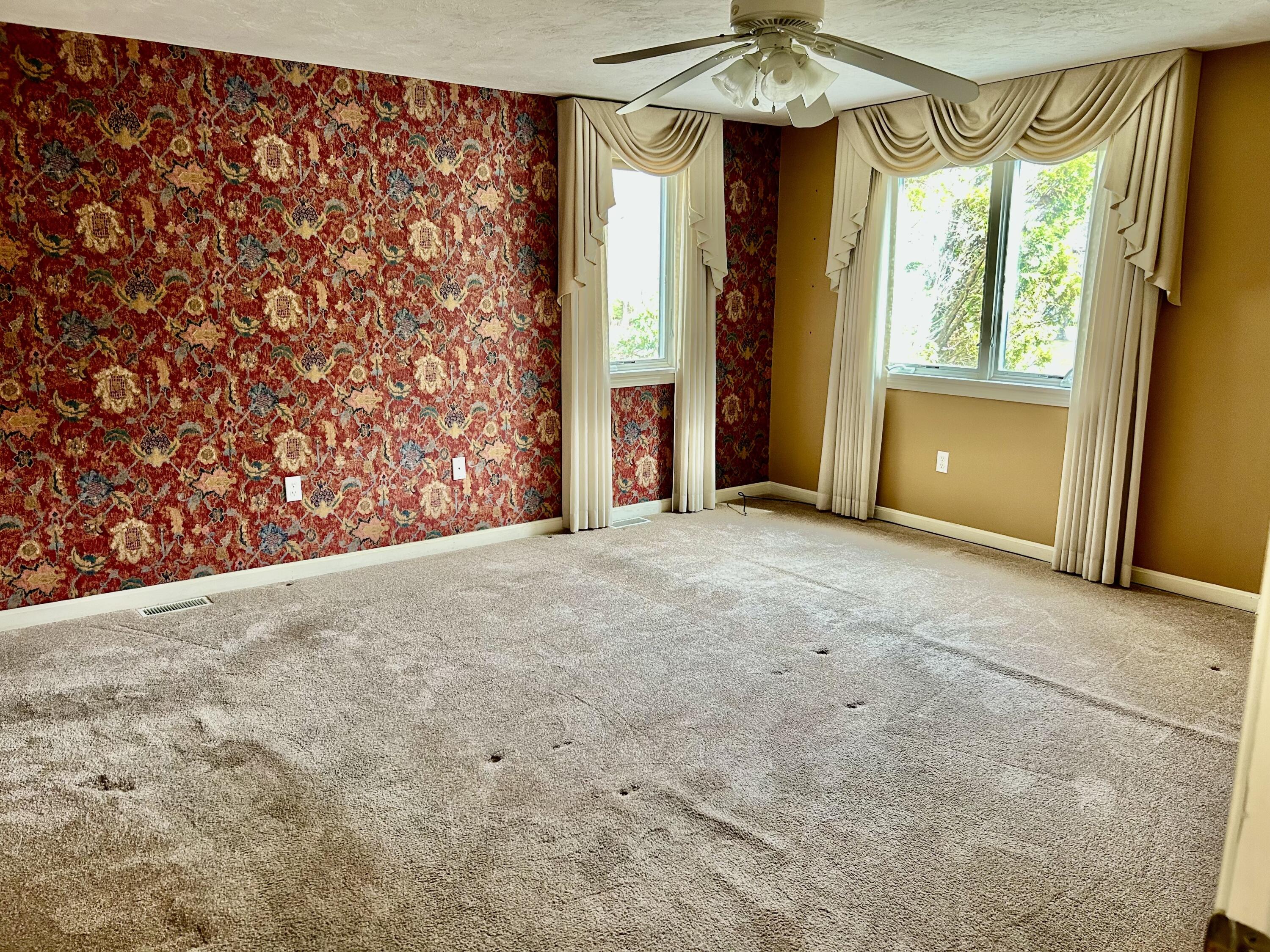 28 Windward Street, Unit 28 Mashpee, MA 02649 - Photo 12 of 37 a view of a big room with windows and chandelier