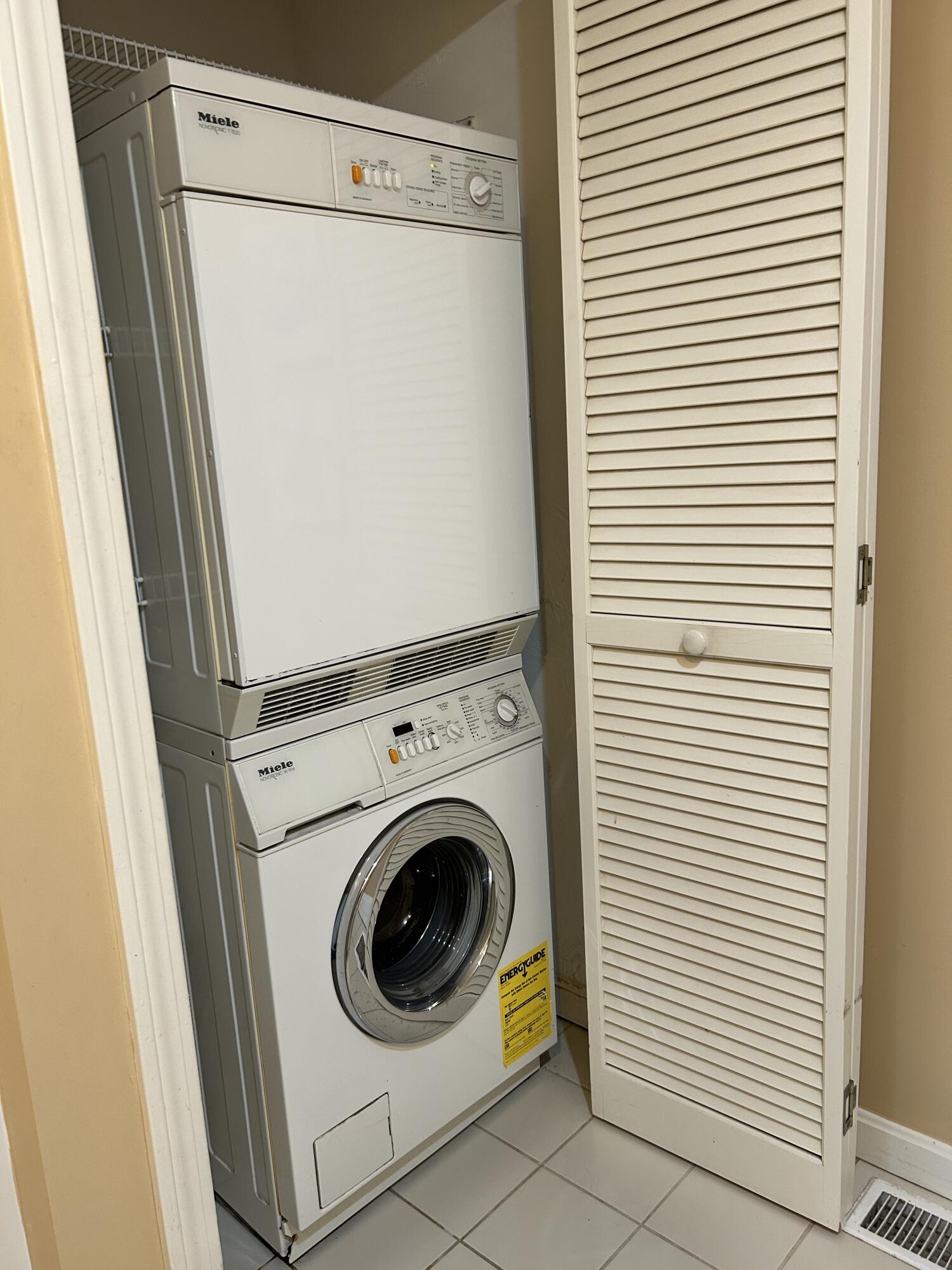 28 Windward Street, Unit 28 Mashpee, MA 02649 - Photo 14 of 37 a utility room with dryer and washer