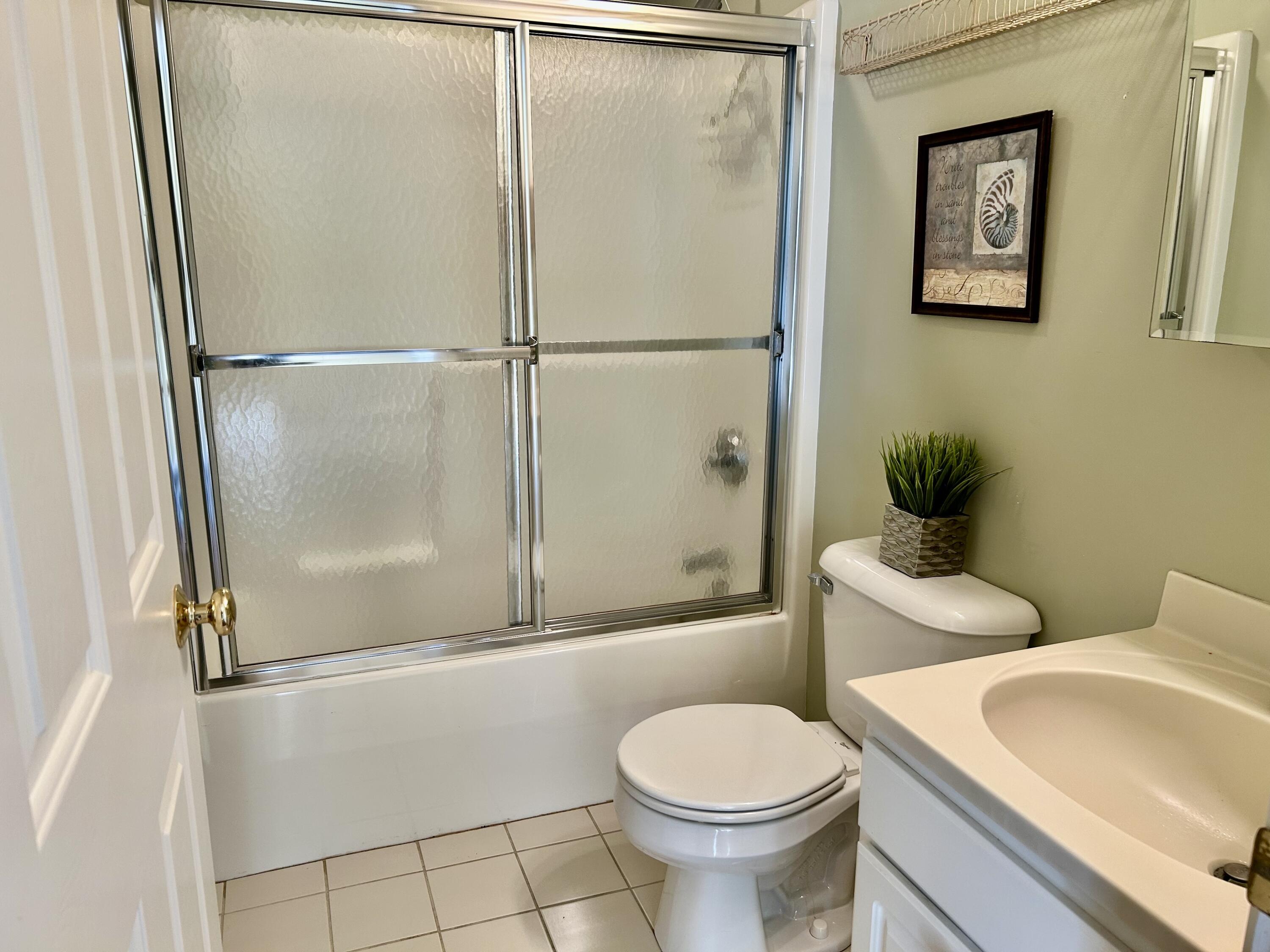28 Windward Street, Unit 28 Mashpee, MA 02649 - Photo 10 of 37 a bathroom with a toilet sink and shower