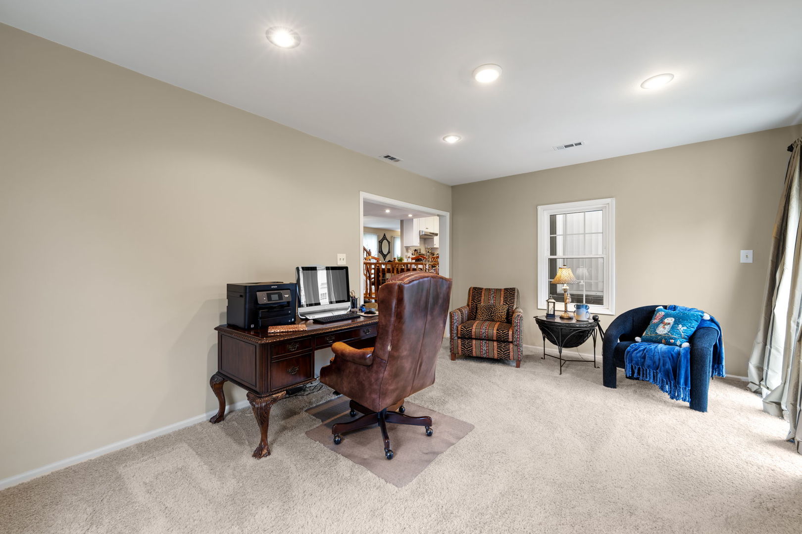 1085 John Drive Hoffman Estates, IL 60169 - Photo 18 of 41 a view of a workspace with furniture and a window