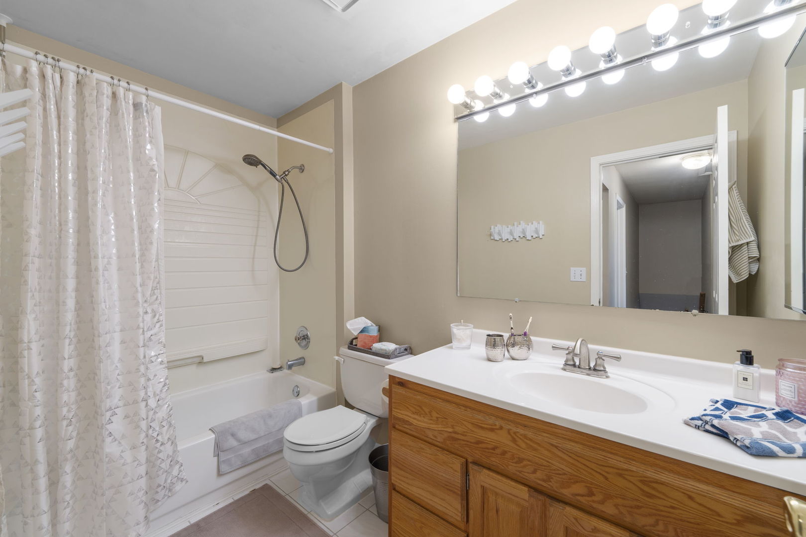 1085 John Drive Hoffman Estates, IL 60169 - Photo 24 of 41 a bathroom with a granite countertop sink toilet and shower