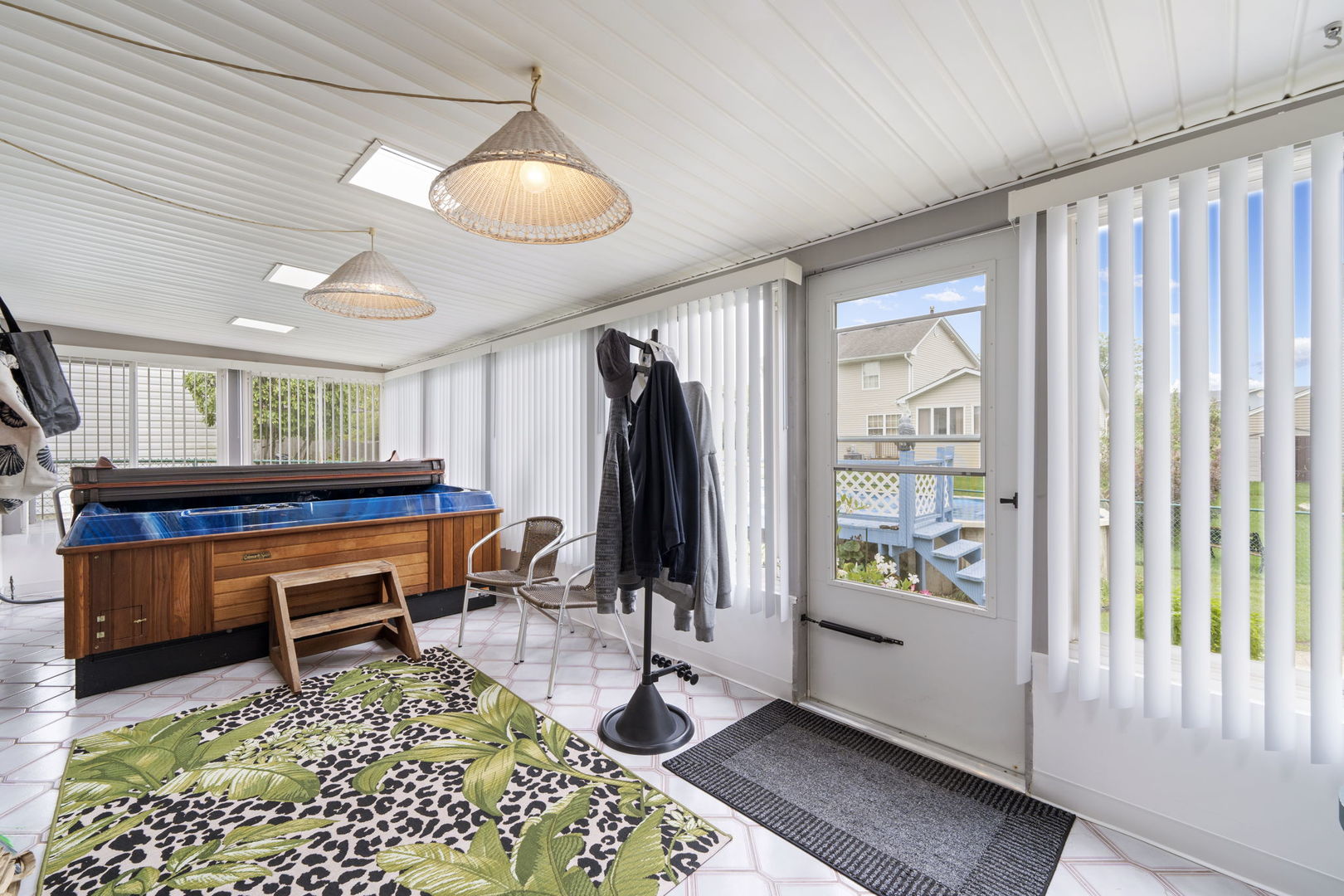 1085 John Drive Hoffman Estates, IL 60169 - Photo 29 of 41 a living room with furniture a window and gym equipment