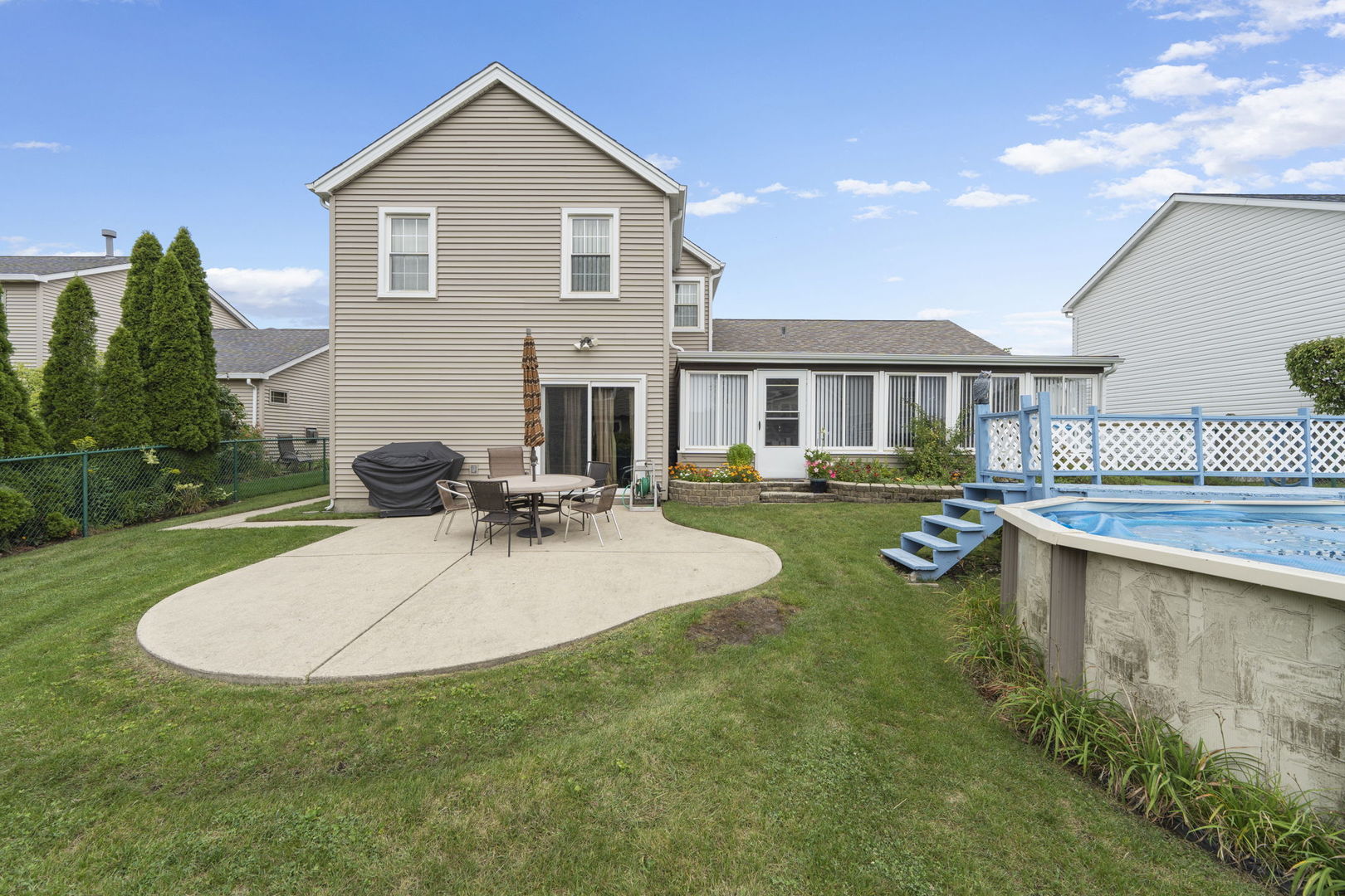 1085 John Drive Hoffman Estates, IL 60169 - Photo 32 of 41 a view of a house with swimming pool yard and patio