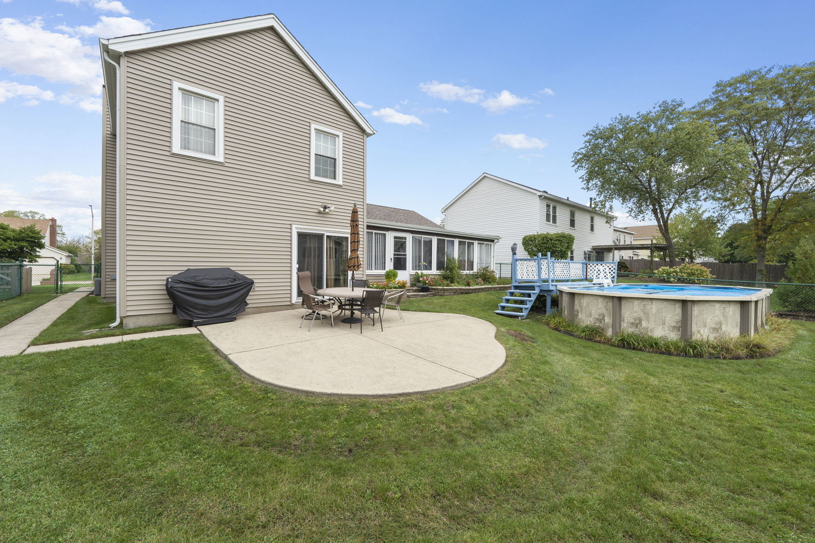 1085 John Drive Hoffman Estates, IL 60169 - Photo 33 of 41 a view of a house with backyard and sitting area