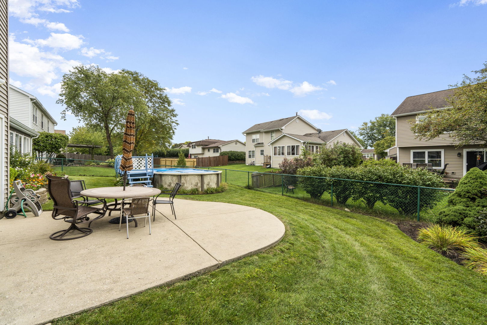 1085 John Drive Hoffman Estates, IL 60169 - Photo 34 of 41 a view of a house with backyard porch and sitting area