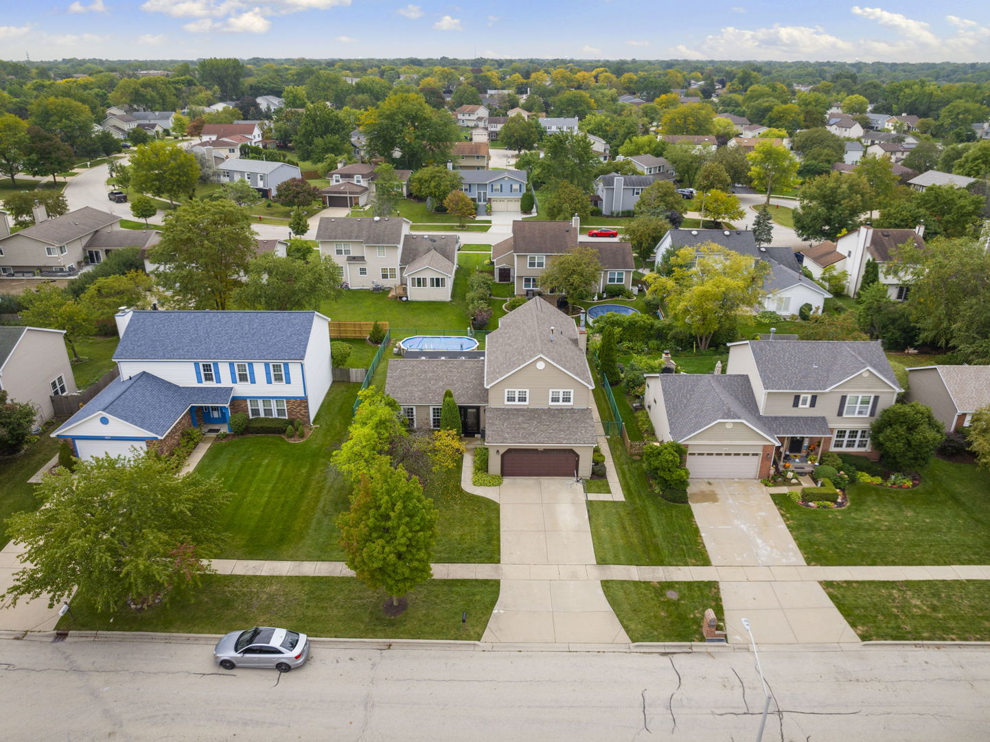 1085 John Drive Hoffman Estates, IL 60169 - Photo 4 of 41 an aerial view of residential houses with outdoor space and parking
