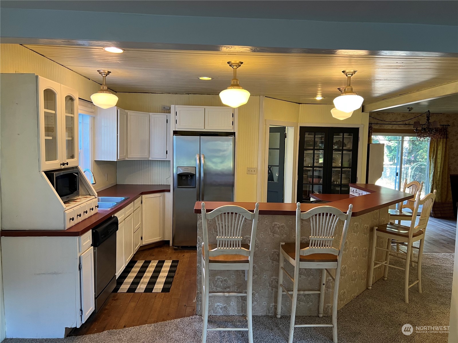 194 Stevens Road Doty, WA 98539 - Photo 8 of 18 a kitchen with a dining table chairs stainless steel appliances and cabinets