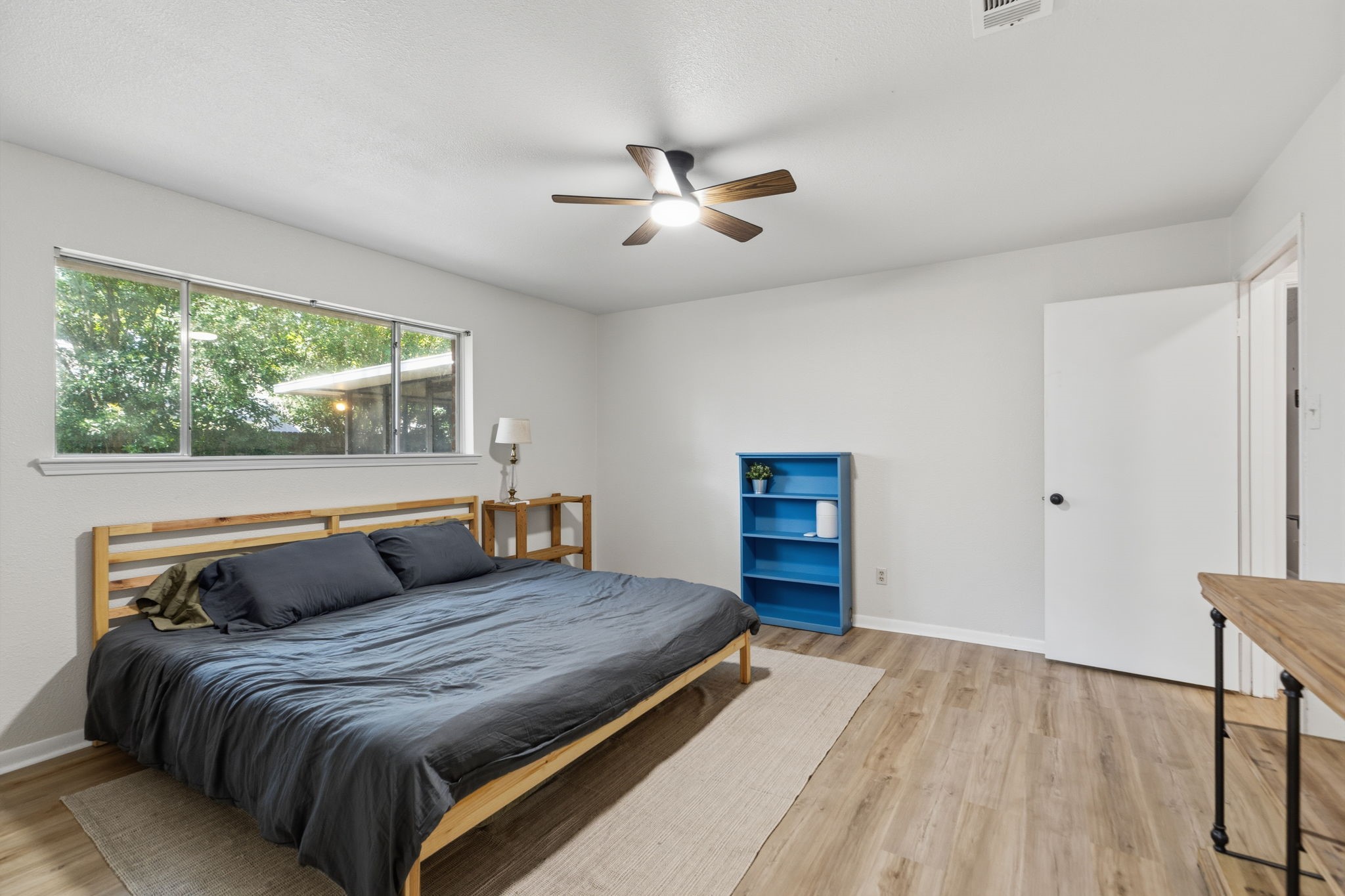 9618 Rannock Way Spring, TX 77379 - Photo 14 of 24 a bedroom with a bed and wooden floor