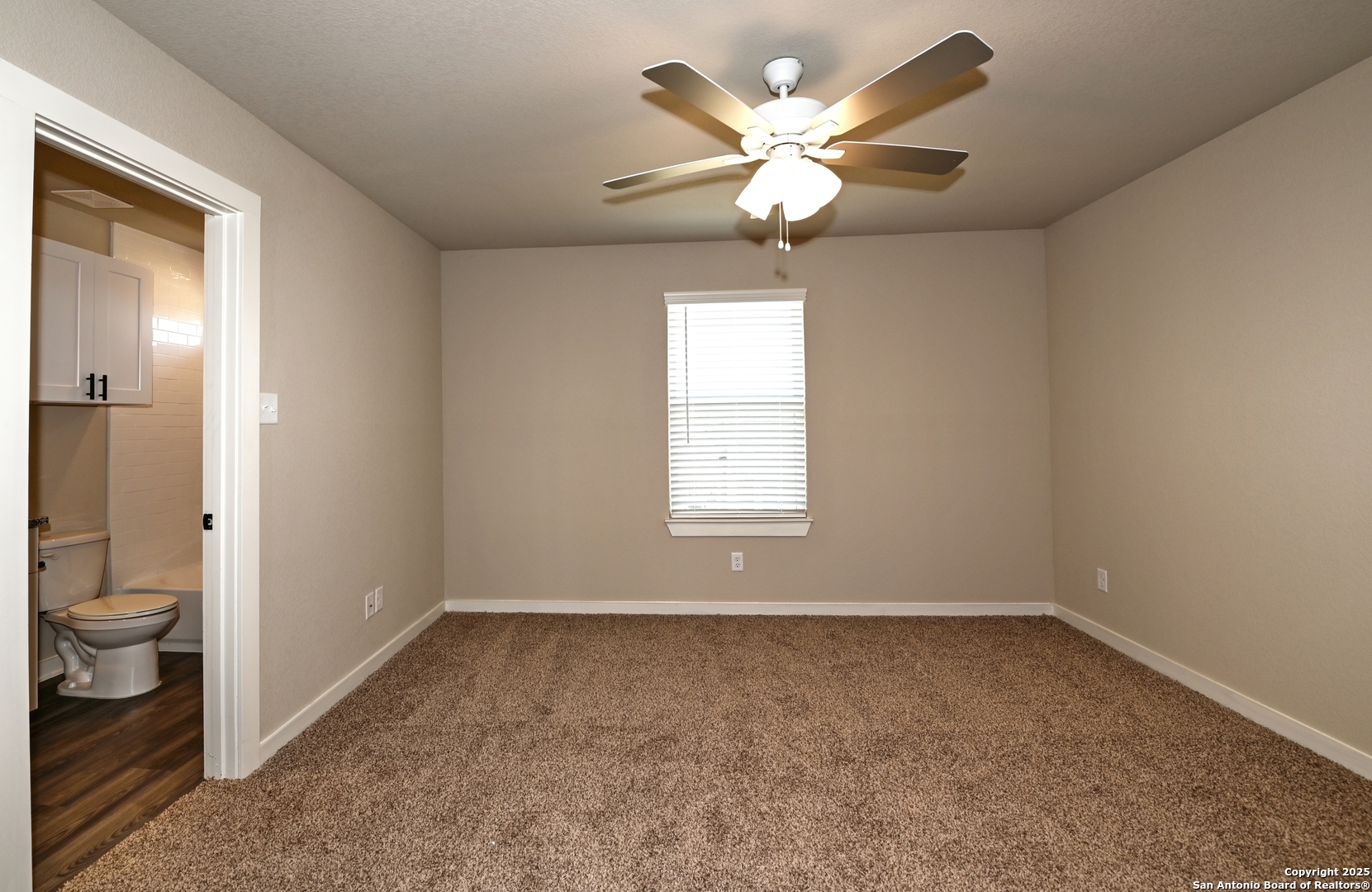 11318 Clearmine, Unit 101 San Antonio, TX 78224 - Photo 25 of 39 wooden floor in an empty room and a bathroom