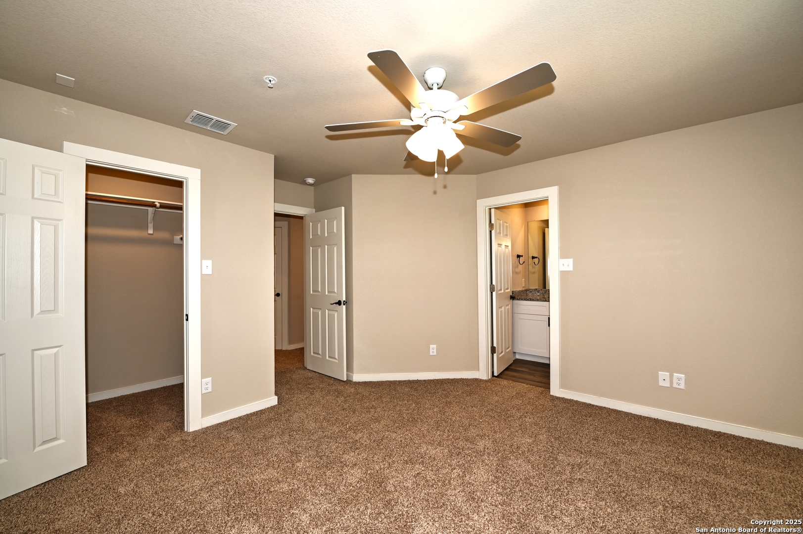 11318 Clearmine, Unit 101 San Antonio, TX 78224 - Photo 26 of 39 an empty room with closet and a ceiling fan