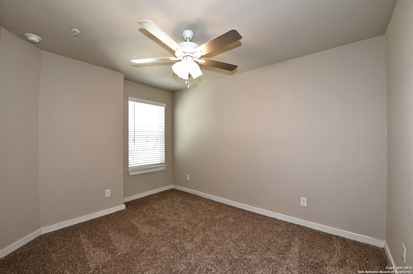 11318 Clearmine, Unit 101 San Antonio, TX 78224 - Photo 31 of 39 an empty room with a window and a fan