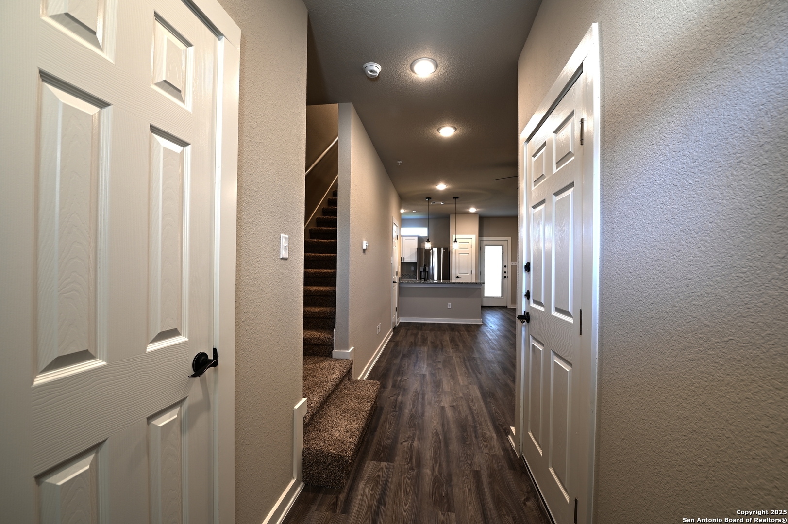 11318 Clearmine, Unit 101 San Antonio, TX 78224 - Photo 4 of 39 a view of a hallway with a furniture