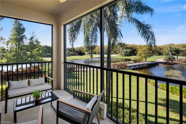 a view of a two chairs in the balcony